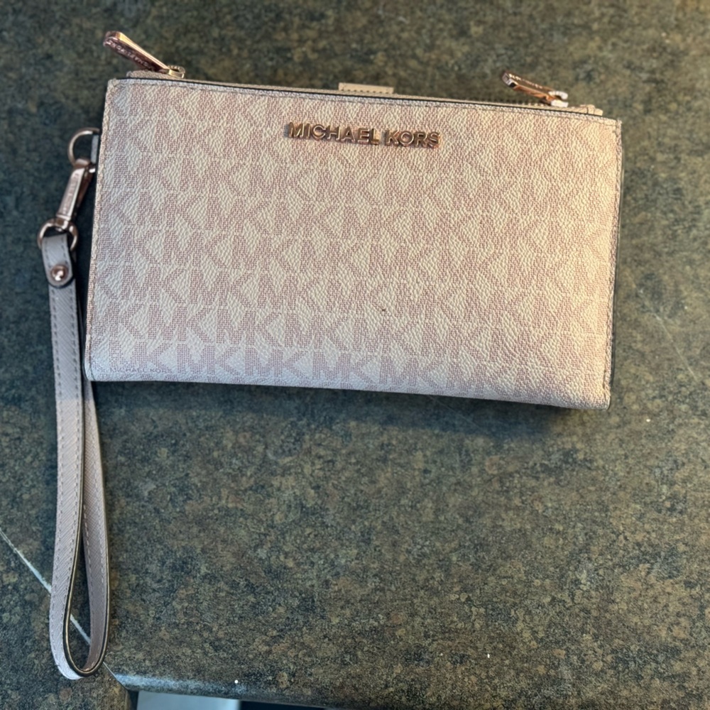 Selling two wallets. One Michael Kors (pink)and one Kate Spade (gold)